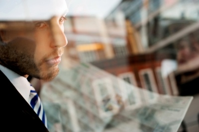 Man looking out the rear window contemplating how much the world outside has changed