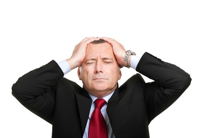 Man holding is head in frustration over Marketing results